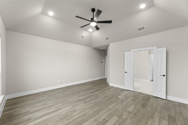 unfurnished bedroom featuring ceiling fan, light hardwood / wood-style floors, and lofted ceiling