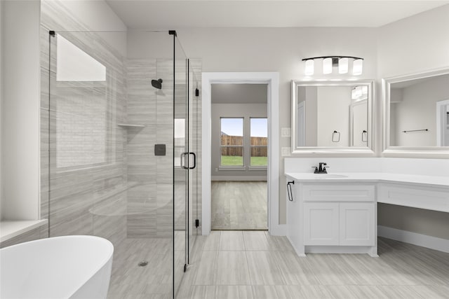 bathroom featuring vanity, hardwood / wood-style flooring, and separate shower and tub