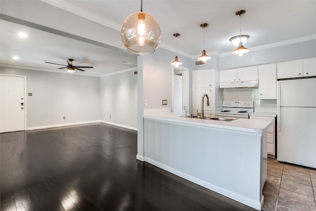 kitchen featuring pendant lighting, white appliances, dark wood-type flooring, sink, and white cabinetry