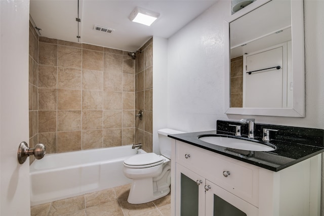 full bathroom featuring tile patterned floors, toilet, vanity, and tiled shower / bath