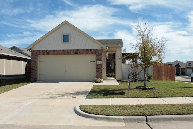 view of front facade featuring a front lawn and a garage