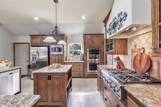 kitchen featuring custom exhaust hood, decorative backsplash, decorative light fixtures, a kitchen island, and stainless steel appliances