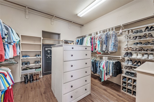 walk in closet featuring light hardwood / wood-style flooring