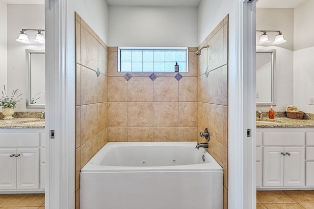 bathroom featuring tile patterned floors, vanity, and tiled shower / bath combo