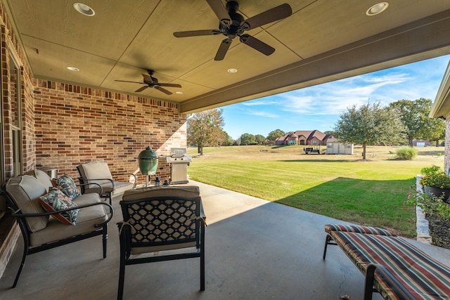 view of patio with an outdoor living space and ceiling fan