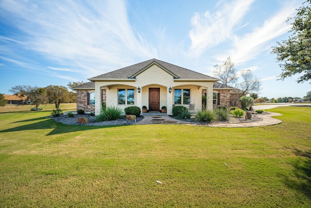 view of front of property featuring covered porch and a front yard