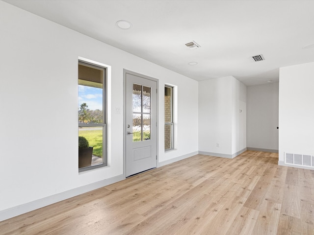 unfurnished room featuring light hardwood / wood-style flooring