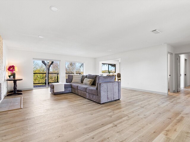 unfurnished living room featuring light hardwood / wood-style flooring