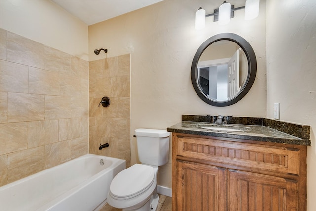 full bathroom featuring vanity, tiled shower / bath combo, and toilet