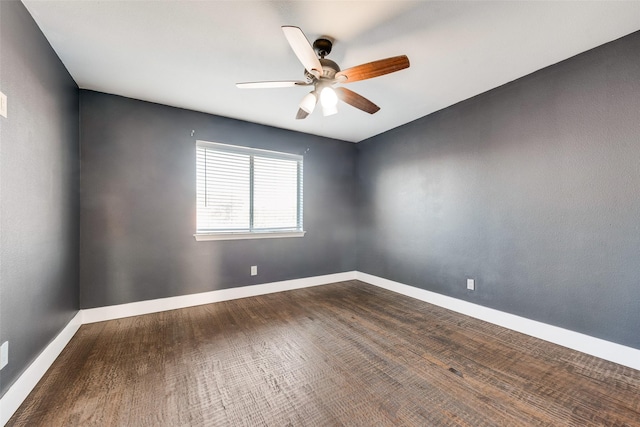 empty room with ceiling fan and hardwood / wood-style flooring