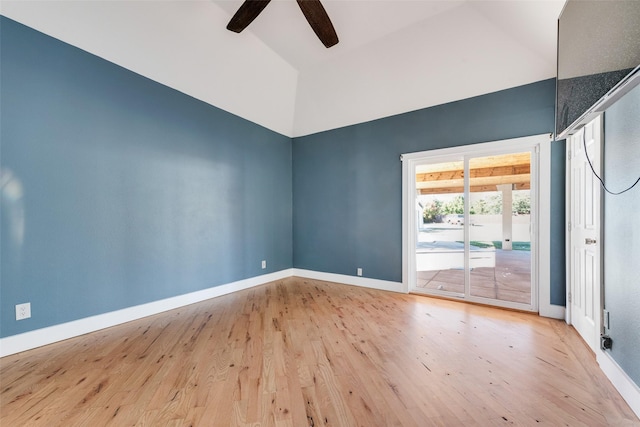 empty room with wood-type flooring, high vaulted ceiling, and ceiling fan