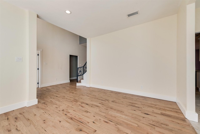 unfurnished living room featuring light hardwood / wood-style flooring