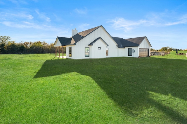 back of house featuring a yard