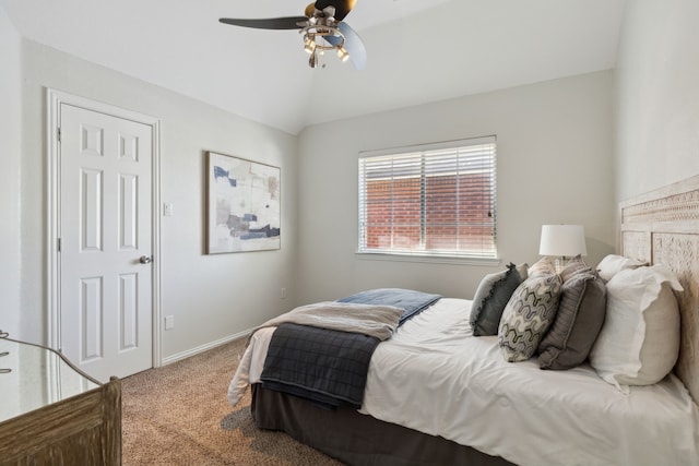 carpeted bedroom with ceiling fan and lofted ceiling