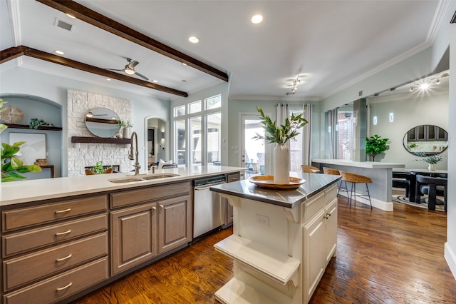 kitchen featuring dishwasher, a center island, dark hardwood / wood-style floors, and sink