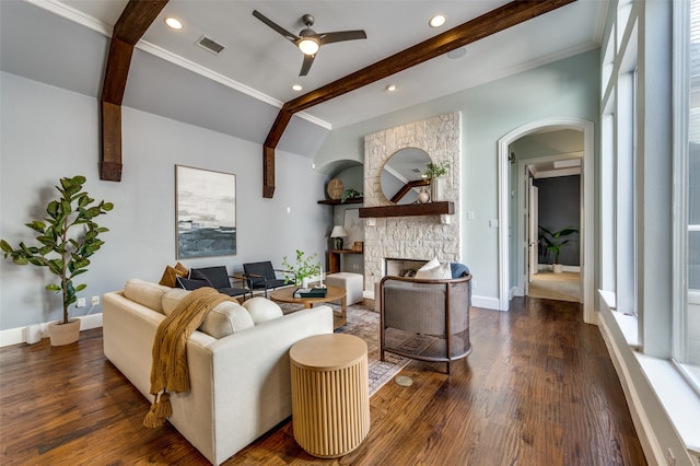 living room featuring vaulted ceiling with beams, ceiling fan, dark hardwood / wood-style flooring, and a fireplace