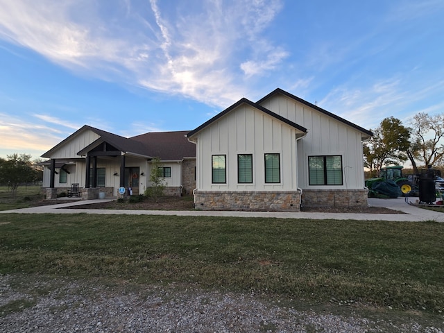 view of front of home featuring a front yard and a porch