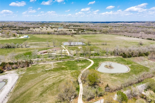 birds eye view of property with a rural view