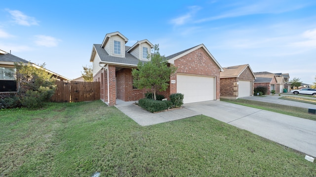 view of front facade with a front yard and a garage