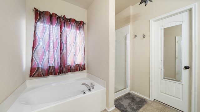 bathroom with tile patterned flooring and plus walk in shower