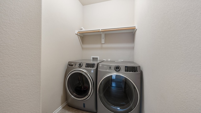 laundry room with washer and clothes dryer