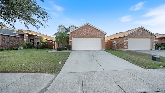 view of front of property with a front yard and a garage