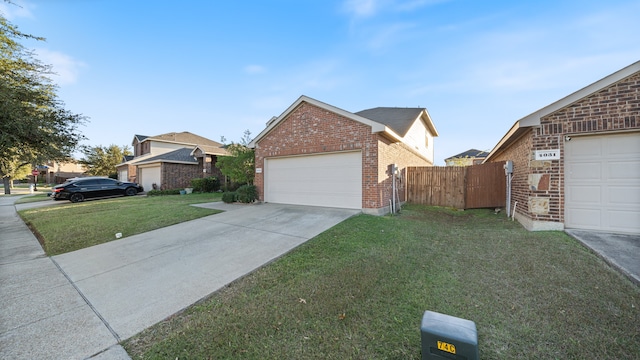 view of front facade featuring a garage and a front lawn