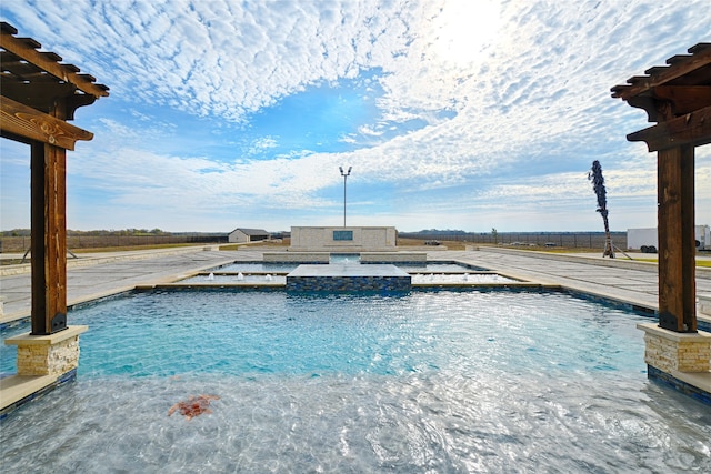 view of pool featuring an in ground hot tub and a patio area