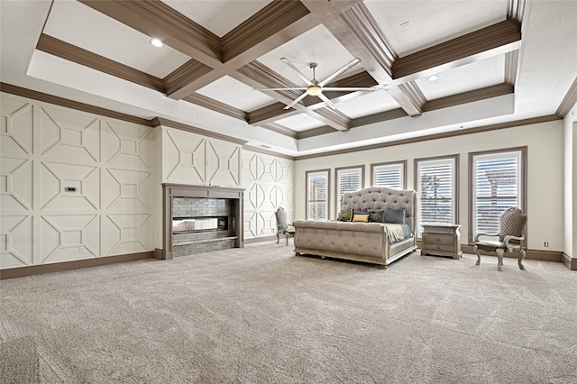 unfurnished bedroom with carpet flooring, ornamental molding, beamed ceiling, and coffered ceiling