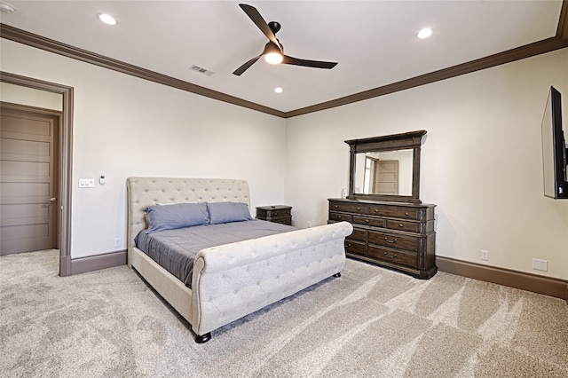 carpeted bedroom featuring ceiling fan and ornamental molding