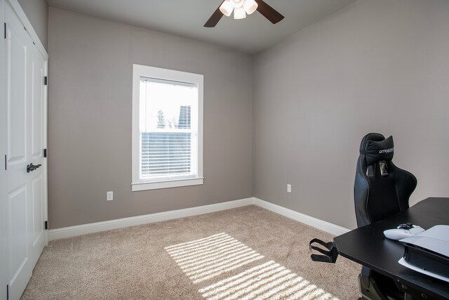 office featuring ceiling fan and light colored carpet