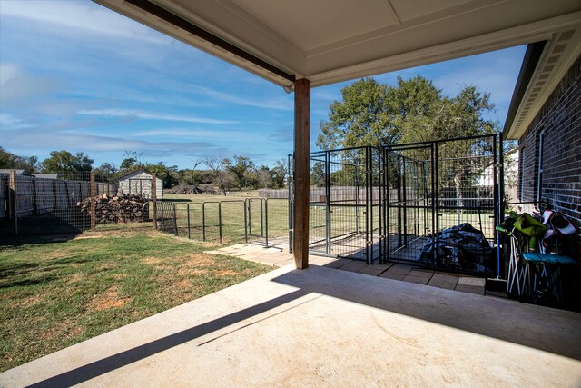 view of patio / terrace with an outbuilding