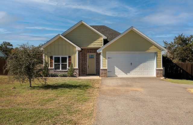 craftsman inspired home featuring a front yard and a garage