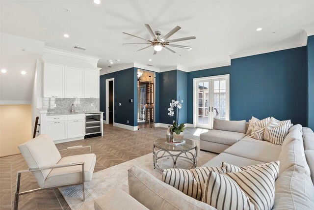 bedroom featuring crown molding, wood-type flooring, and ensuite bathroom