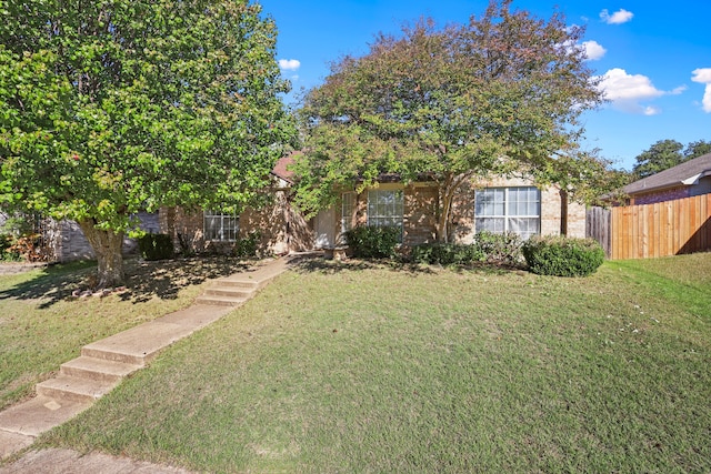 view of front of home with a front lawn