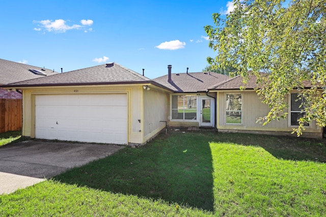 ranch-style house with a garage and a front lawn