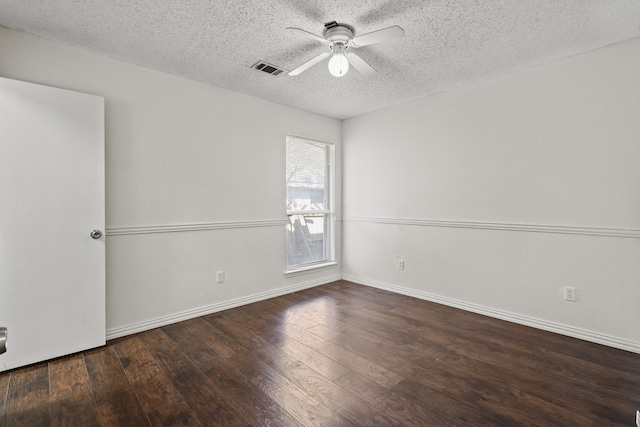 unfurnished room featuring a textured ceiling, ceiling fan, and dark wood-type flooring