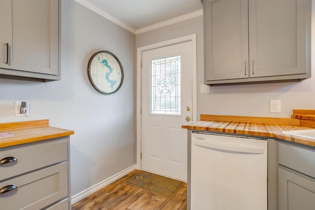 interior space with wood counters, dark wood-type flooring, white dishwasher, gray cabinets, and ornamental molding