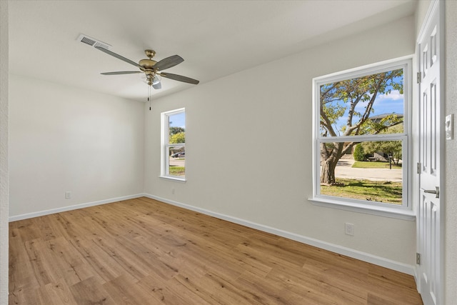 empty room featuring light hardwood / wood-style floors and ceiling fan