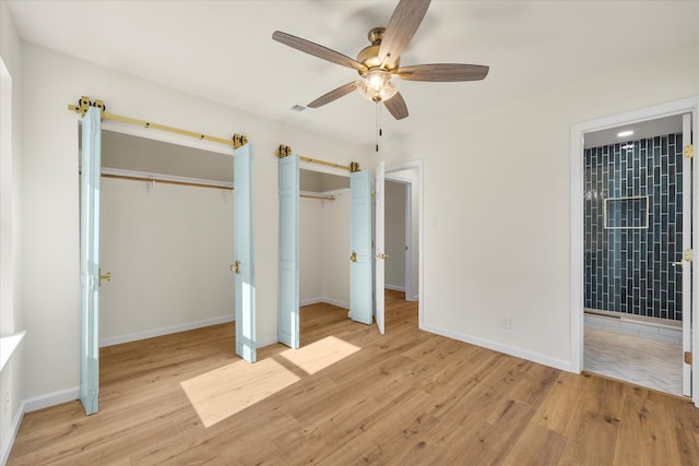 unfurnished bedroom with ceiling fan and light hardwood / wood-style floors