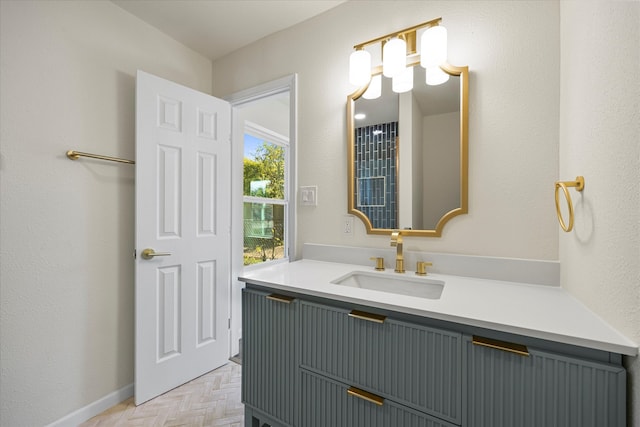 bathroom with vanity and parquet floors