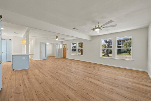 foyer entrance with ceiling fan, french doors, and light hardwood / wood-style floors