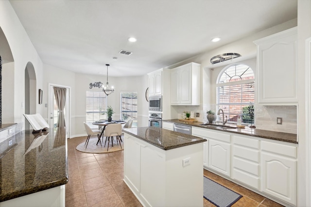 kitchen featuring white cabinetry, sink, and appliances with stainless steel finishes