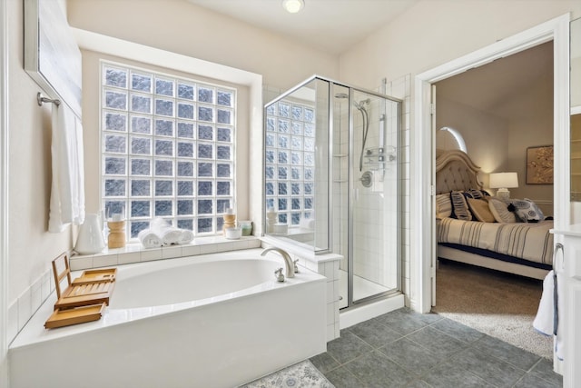 bathroom featuring tile patterned flooring and independent shower and bath