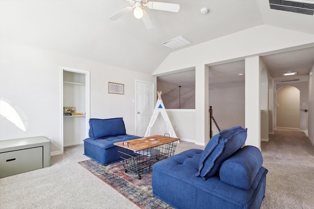 living room with light carpet, ceiling fan, and lofted ceiling