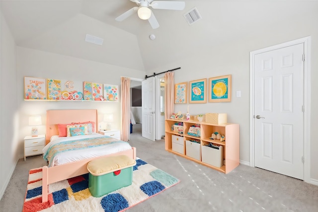 bedroom featuring a barn door, light colored carpet, vaulted ceiling, and ceiling fan