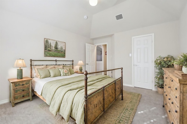 bedroom with vaulted ceiling and carpet