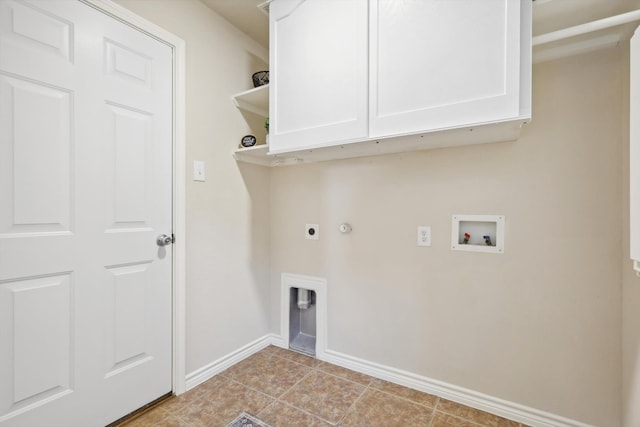 washroom with cabinets, hookup for a washing machine, hookup for an electric dryer, gas dryer hookup, and light tile patterned flooring