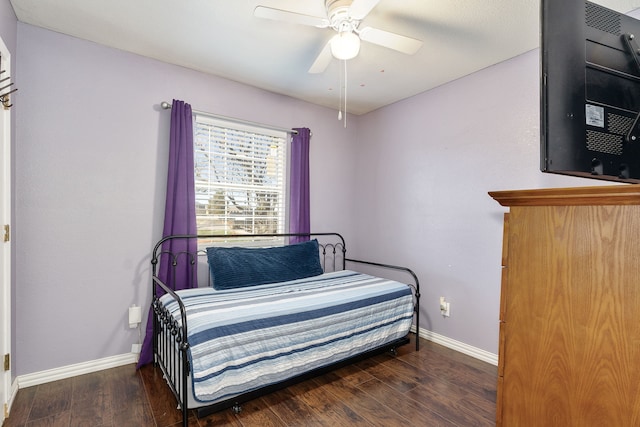 bedroom featuring ceiling fan and dark wood-type flooring