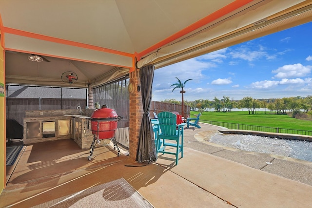 view of patio / terrace featuring a gazebo and exterior kitchen